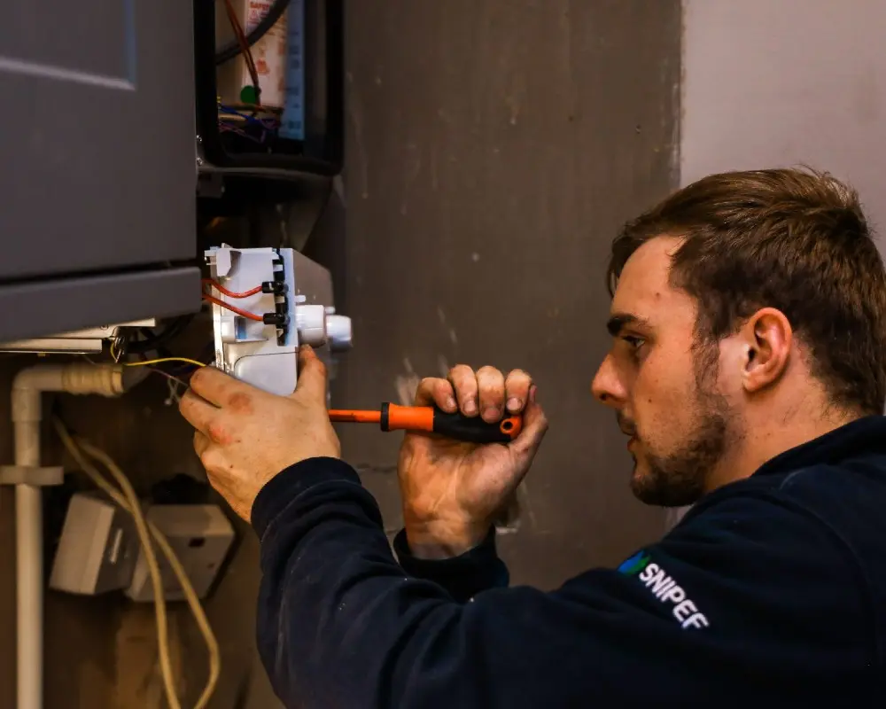 Plumber testing gas safety before issuing a CP12 gas safety certificate.