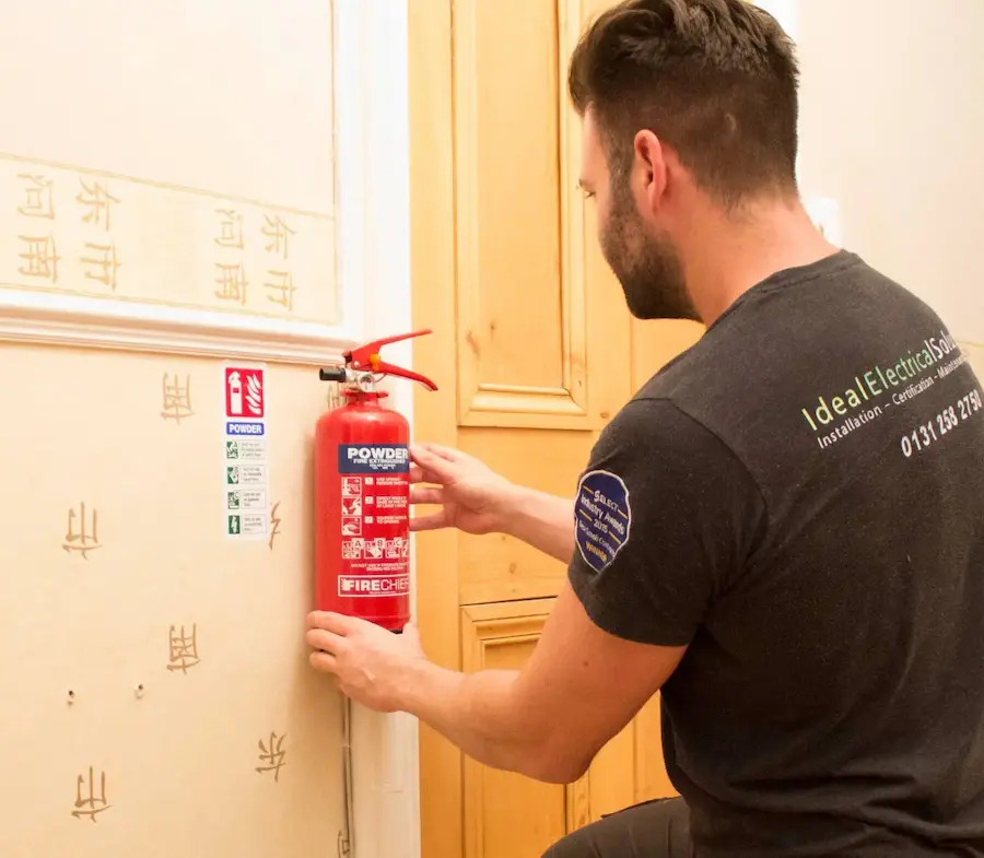 An Ideal electrician during fire extinguisher testing at this Edinburgh premises.