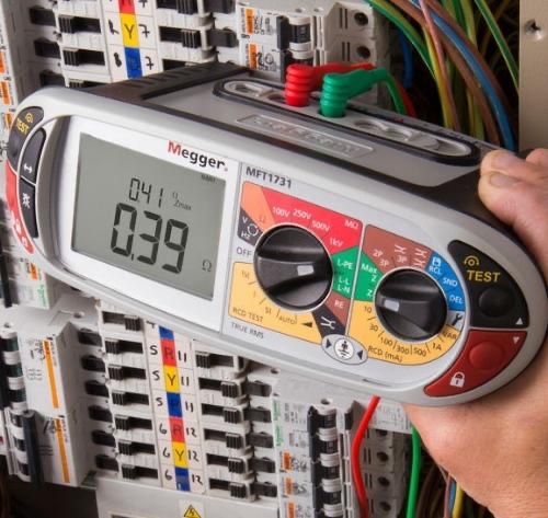 Using a Megger multi-function tester during an EICR test.