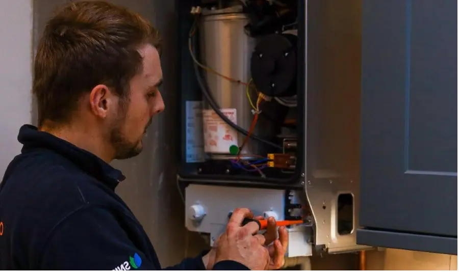 Gas Safe engineer undertaking gas safety checks on a gas boiler in Edinburgh.