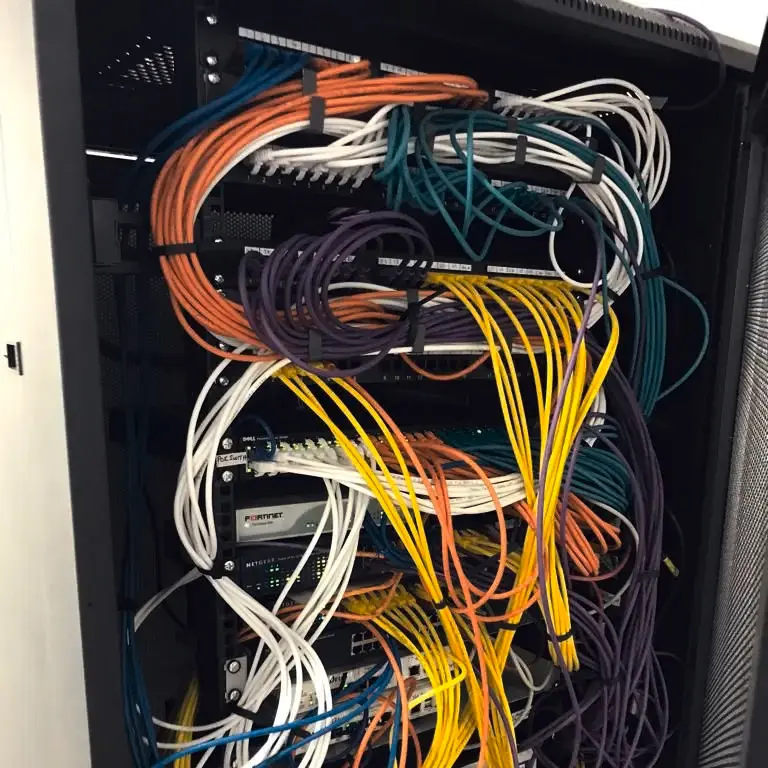 A data cabling installation with tidy data cables into the server rack.