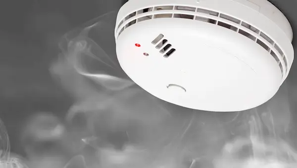 Smoke alarm detecting smoke.