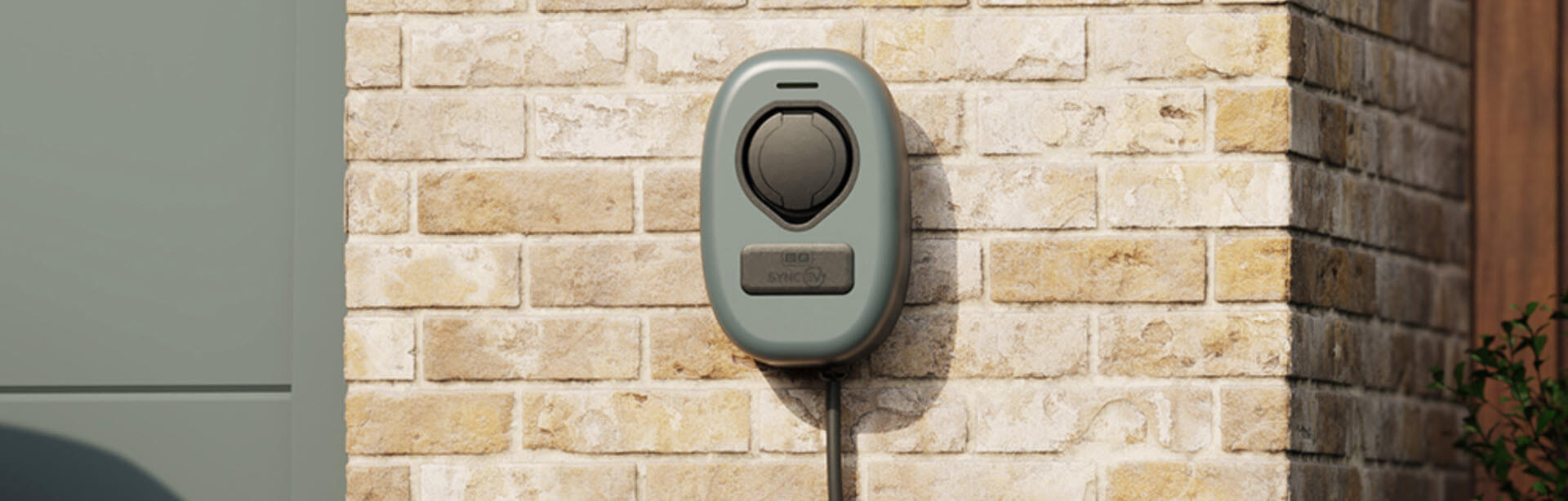 BG Sync EV charger installed on the exterior wall next to the garage.