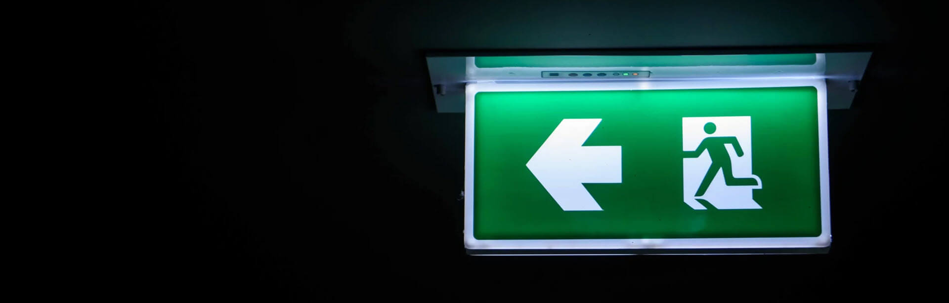 Emergency exit light undergoing an inspection, test and certification.