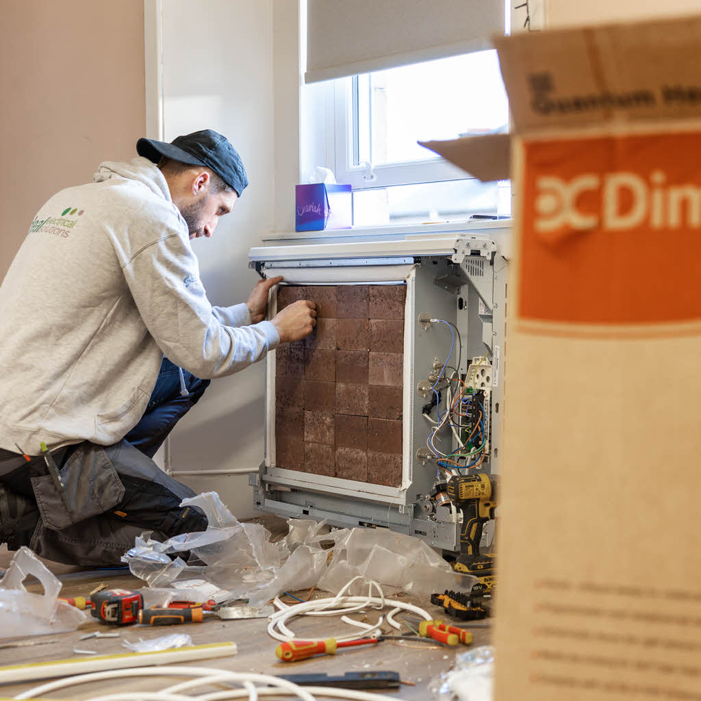 Installing the first Dimplex Quantum storage heater.