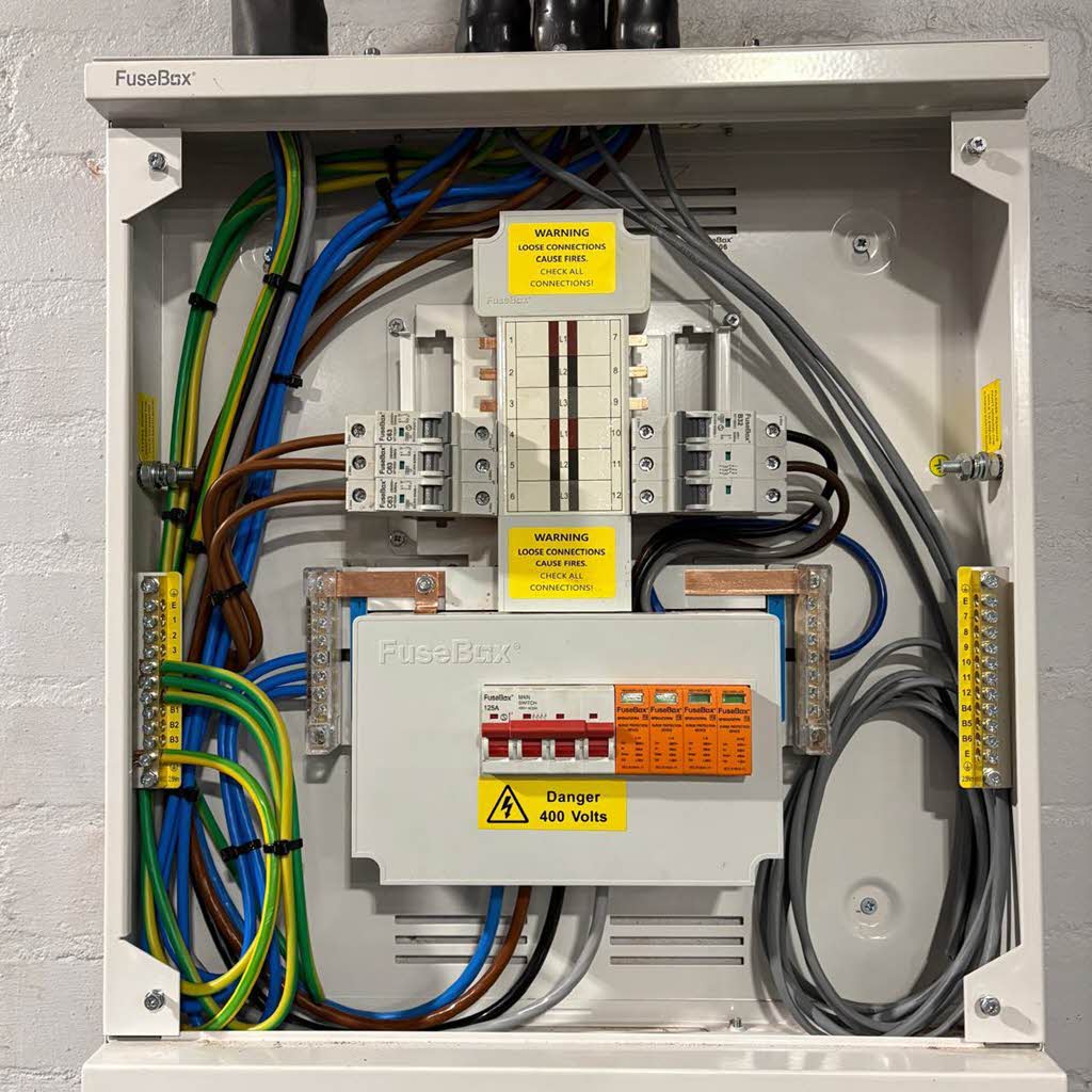 Newly installed 3-phase consumer unit with surge protection and RCBOs.